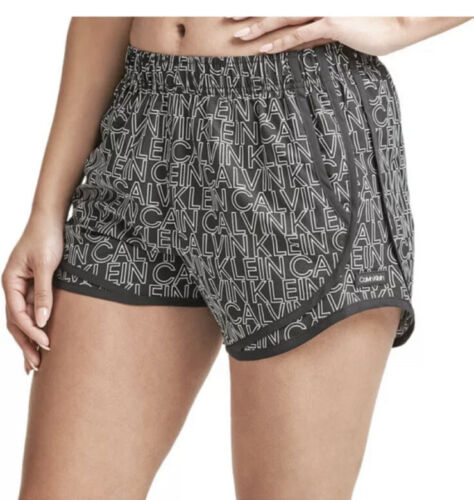 CALVIN KLEIN BLACK AND WHITE LINED RUNNING SHORTS WOMAN