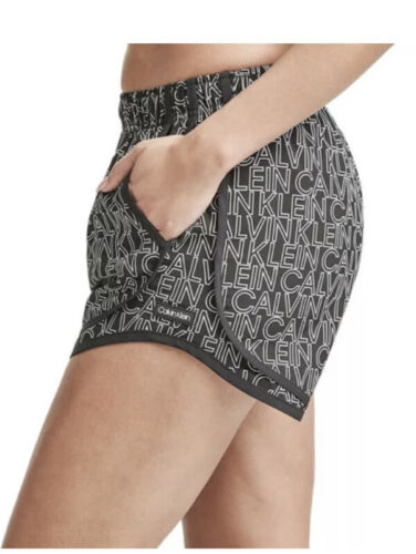 CALVIN KLEIN BLACK AND WHITE LINED RUNNING SHORTS WOMAN